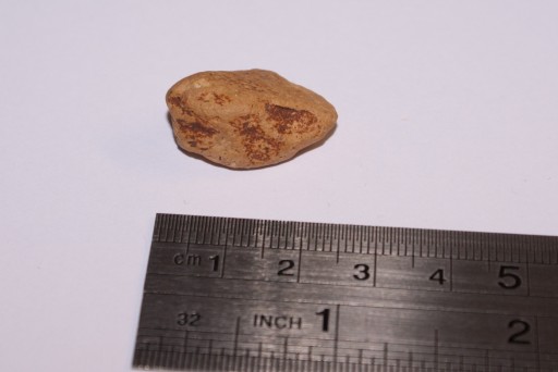steen met centimeter